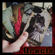 Hand holding several Oracle of Shadows cards by Cyb, gothic art and digital vanitas.